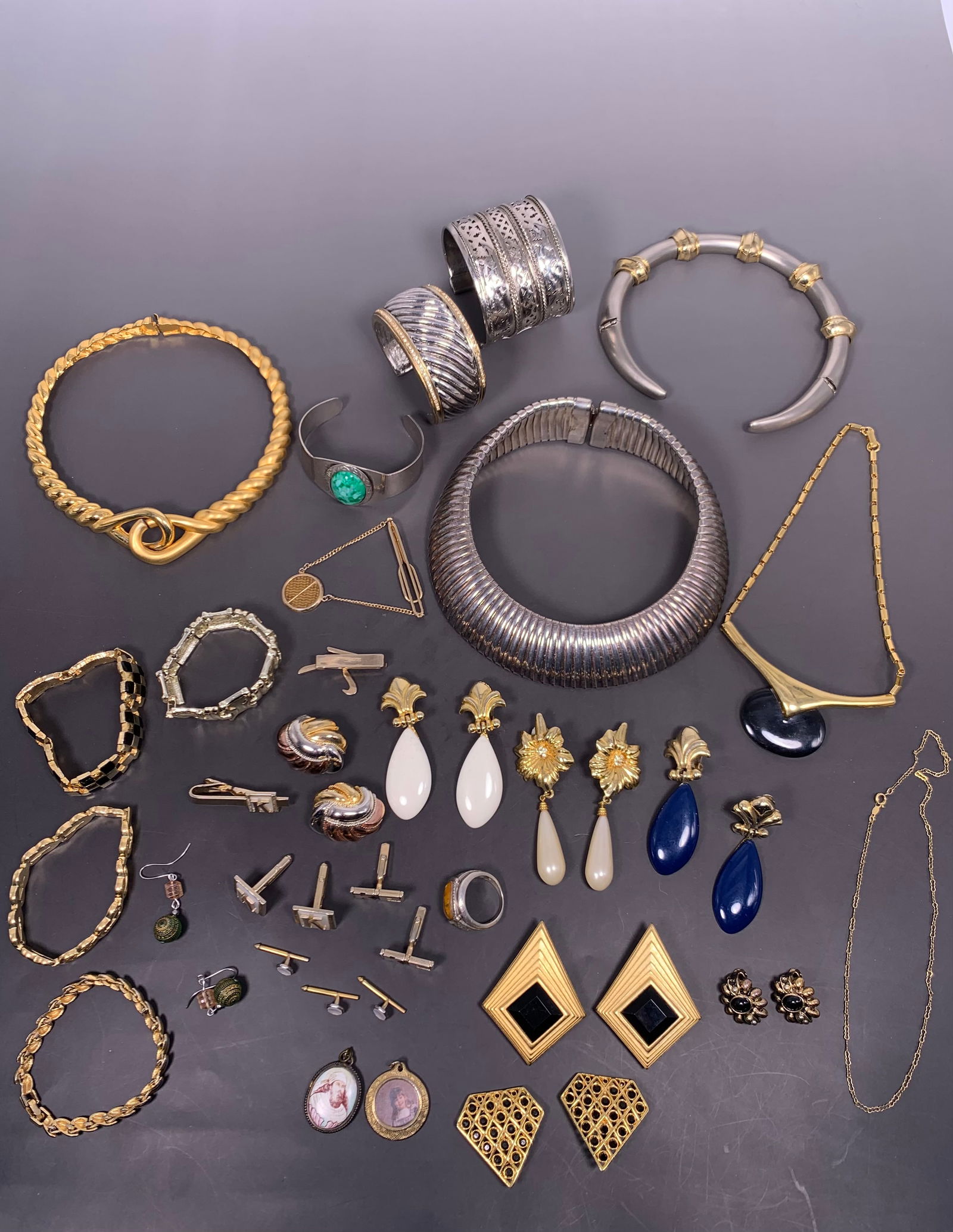 A Group of Twenty-Nine Jewelry Items: Comprising a total of twenty nine bangles, necklaces, earings, and cufflinks in various sizes and materials.