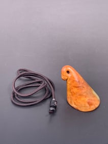 A Chinese Celadon and Russet Jade Pendant