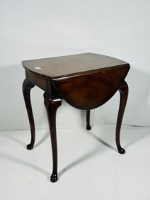 A Small Wood Table with Drop Leaves