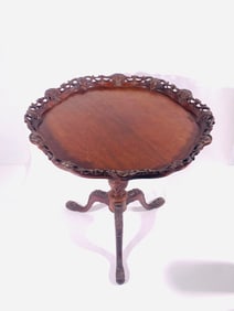 A Carved Mahogany Pie-Crust Top Tripod Table