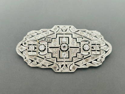 An Art Deco Diamond-Inset White Gold Brooch: 2.3/4 in. long, 1.3/8 in. wide.