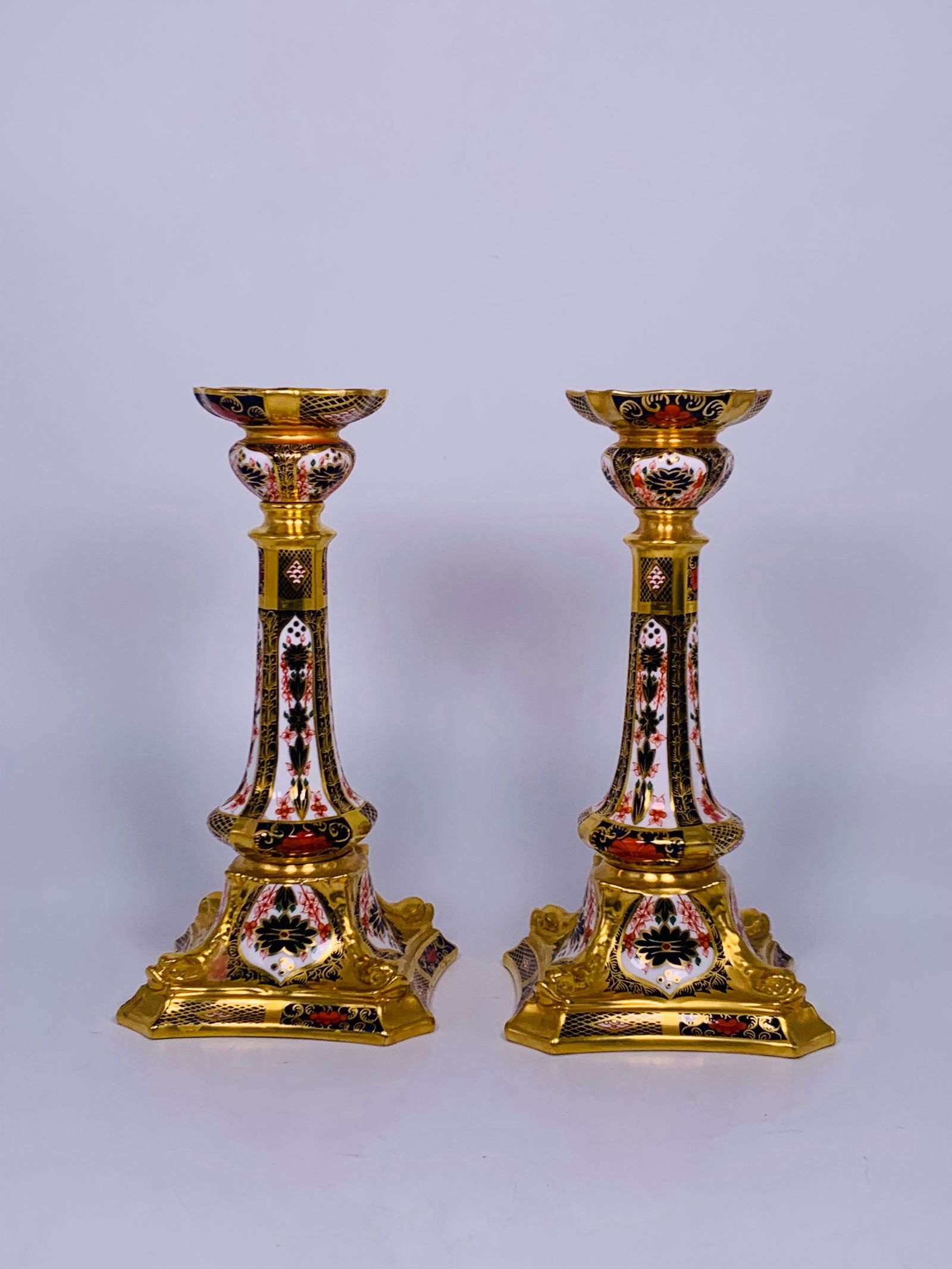 A Pair of Royal Crown Derby English Bone China Candles: Manufacturer's mark to the bottom, with a model number 1128 XXXIX. 10.3/8 in. high, 5.1/4 in. wide each.