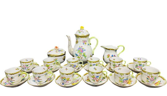 A Set of Twenty-Seven Herend Queen Victoria Tea Service, 20the century, Blue Printed Marks: Painted with butterflies and flowers, comprising a teapot and cover, 8.3/8 in. high, 6.3/4 in. wide; a 4.1/8 in. high, 5.3/8 in. wide; a sugar bowl and cover, 3.7/8 in. high, 4.1/8 in. wide; a set of