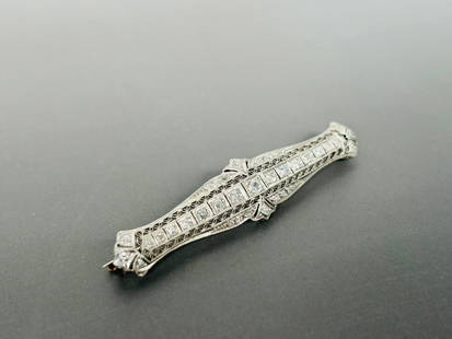 A Vintage White Gold Diamond Bar Brooch: 2.5/8 in. long, 5/8 in. wide.