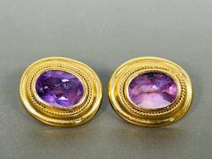 A Pair of Vintage Oval Cut Amethyst 14K Pins: '14K' marks to both pins, 1 in. long, 3/4 in. wide each. Weighs 6 grams each.