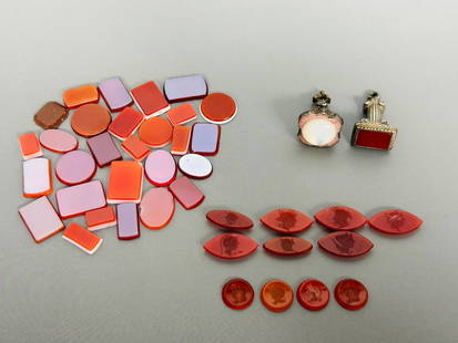 A Group of Forty-One Agate and Glass Objects: Comprising a group of eleven Roman carnelian agate seal intaglios in circular or oval shape, with largest measures 7/8 in. long, 3/8 in. wide; a group of twenty-eight glass mosaic tiles, with the
