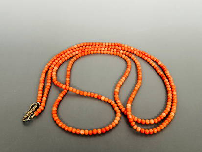 A String of Coral Beads, Necklace: With a silver clip, '925' mark to one hook. 56 in. long for the necklace.
