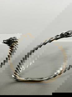 An Antique Silver 'Goat Head' Bracelet, Possibly Achaemenid Empire: 3 in. long, 2.5/8 in. wide.