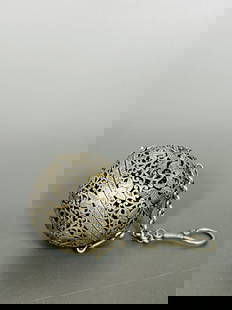 A Chinese Silver Reticulated Spherical Incense Burner/Hand Warmer: 2.1/4 in. diam. Weight will be updated shortly.