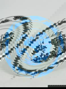 A Chinese Blue and White 'Garden Rocks' Dish, Kangxi Period, Qing Dynasty: With an apocryphal Chenghua mark to the bottom. 8.75 in. diam.