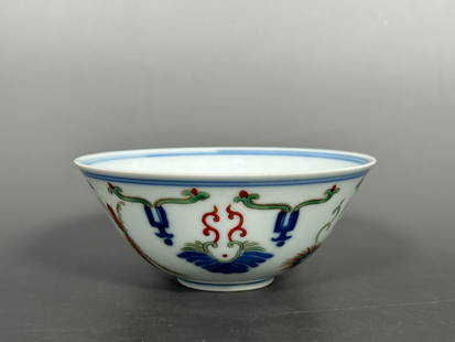 A Chinese Wucai and Underglaze-Blue-Decorated Bowl, Qianlong Mark, Qing Dynasty: 2 in. high, 4.25 in. diam.