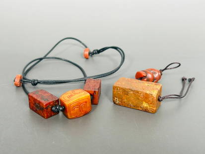 Three Chinese Inscribed Rectangular Beads, Gangmao and One Carved Bead: Comprising one inscribed stone bead, gangmao, as a pendant, 1.1/4 in. high, 1/2 in. square; a string of two inscribed jade beads, gangmao together with one carved jade bead, as a necklace, 7/8 in. hig