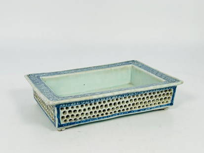 A Chinese Blue and White Reticulated Rectangular Jardiniere: 2 in. high, 9.1/4 in. long, 6.1/4 in. wide.