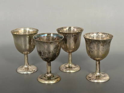 A Group of Four Chinese Incised Silver Cups, Yuan Kang Mark: With maker's mark 'Yuan Kang' to the bottom rims. 3.1/8 in. high, 2 in. wide each.