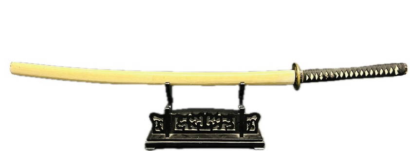 A Japanese Samurai Sword, Tachi, Signed and Dated, Possible Later Reproduction: Tsuba with design of dragon and warrior, signed Sekijoken Motozane, with a date the First Year of Showa Era (1312 CE), possibly later reproduction. Cutting edge measures 29.1/2 in. long, overall 43.1/
