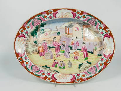 A Chinese Famille Rose 'Figural' Oval Serving Dish: 14.3/8 in. long, 10.3/4 in. wide.