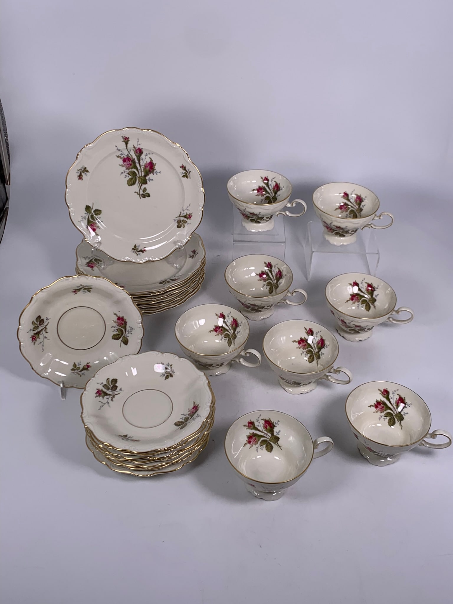 Royal Standard Bone China ?Rose? Tea Set, Service for Eight: A fine Royal Standard Bone China tea service for eight, each piece decorated with hand-painted red roses and foliage, highlighted with gilt rims. The set comprises: ? 8 tea cups 5 in. wide, 2 3/4 in.