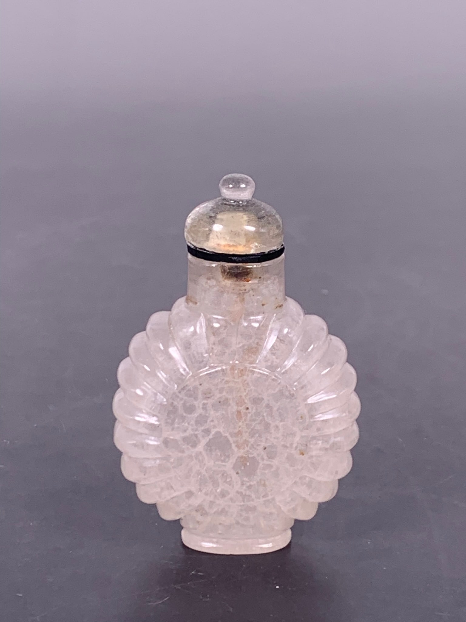 A Chinese Carved Crystal Snuff Bottle: 2.3/4 in. high, 1.3/4 in. wide.
