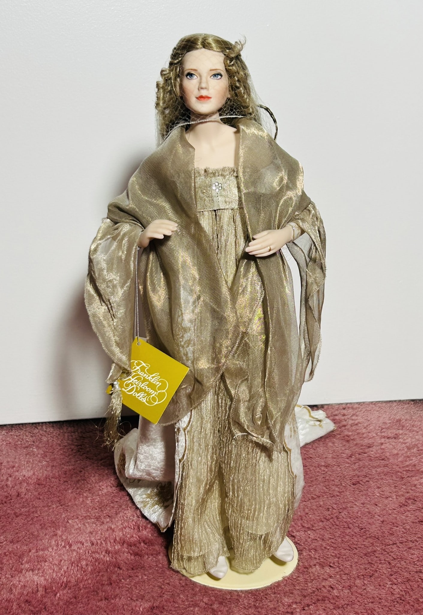 A Franklin Mint Guinevere Queen Of Camelot Doll: 17 in. high, 7 in. wide.The lot is stored in a residential address, appointment required for preview.