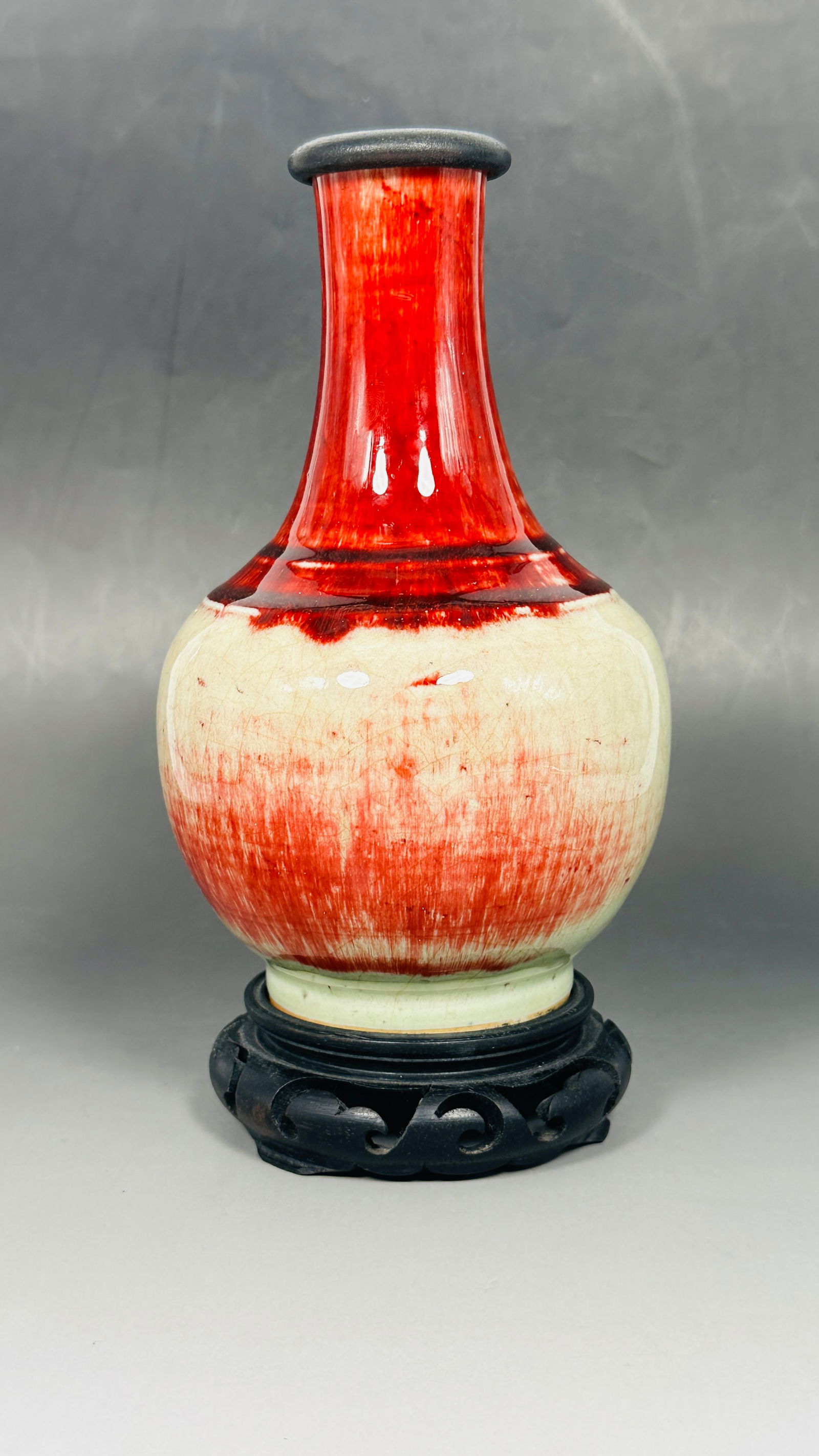 A Chinese Langyao Style Vase, Qing Dynasty: With a wood cover and a wood stand. The vase measures 7.3/4 in. high, 4.1/2 in. wide.
