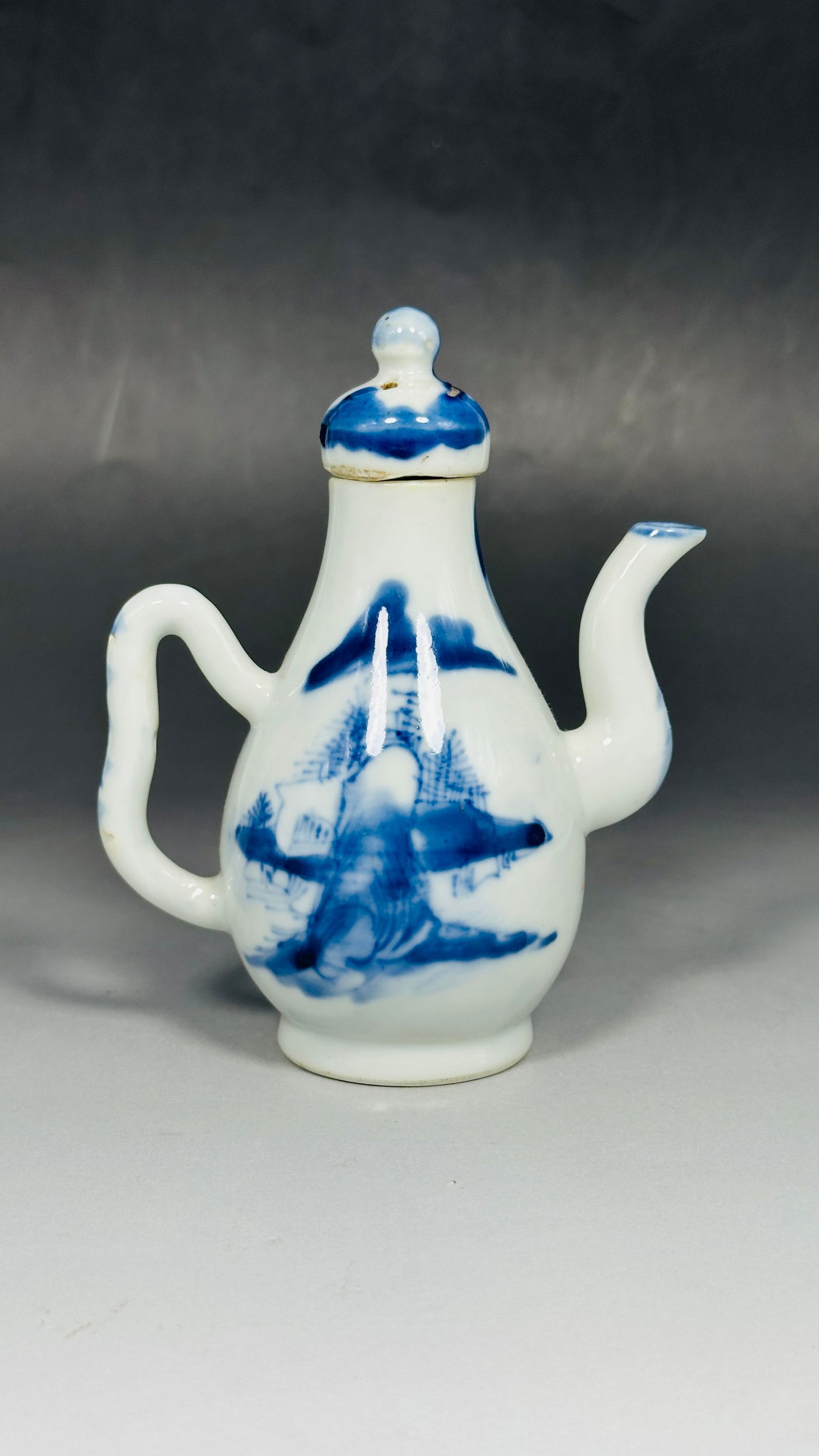 A Small Chinese Blue and White Ewer and Cover, Late Qing Dynasty: 5.1/4 in. high, 4 in. wide.