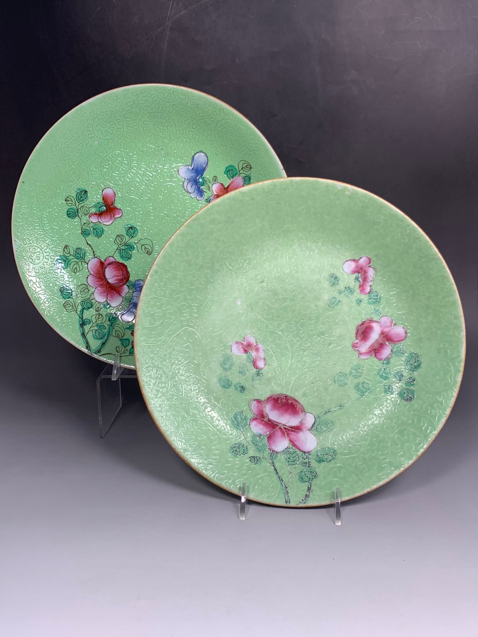 Two Chinese Famille Rose Lime-Green-Sgraffiato-Ground 'Flower' Dishes: One measures 9.5/8 in. diam.; the other measures 9.7/8 in. diam.