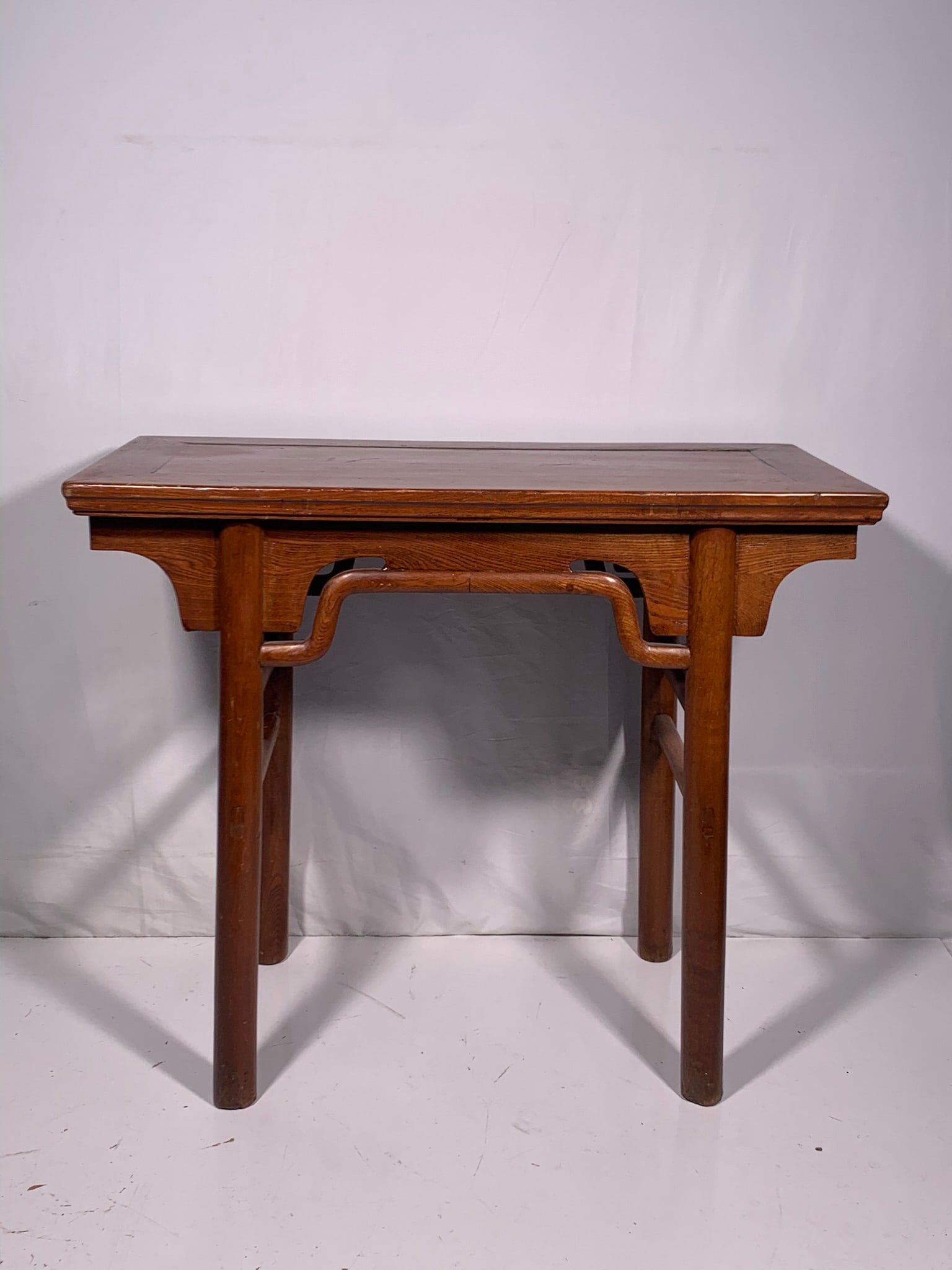 A Chinese Elm Table: 32 in. high, 38 in. wide, 19 in. deep.
