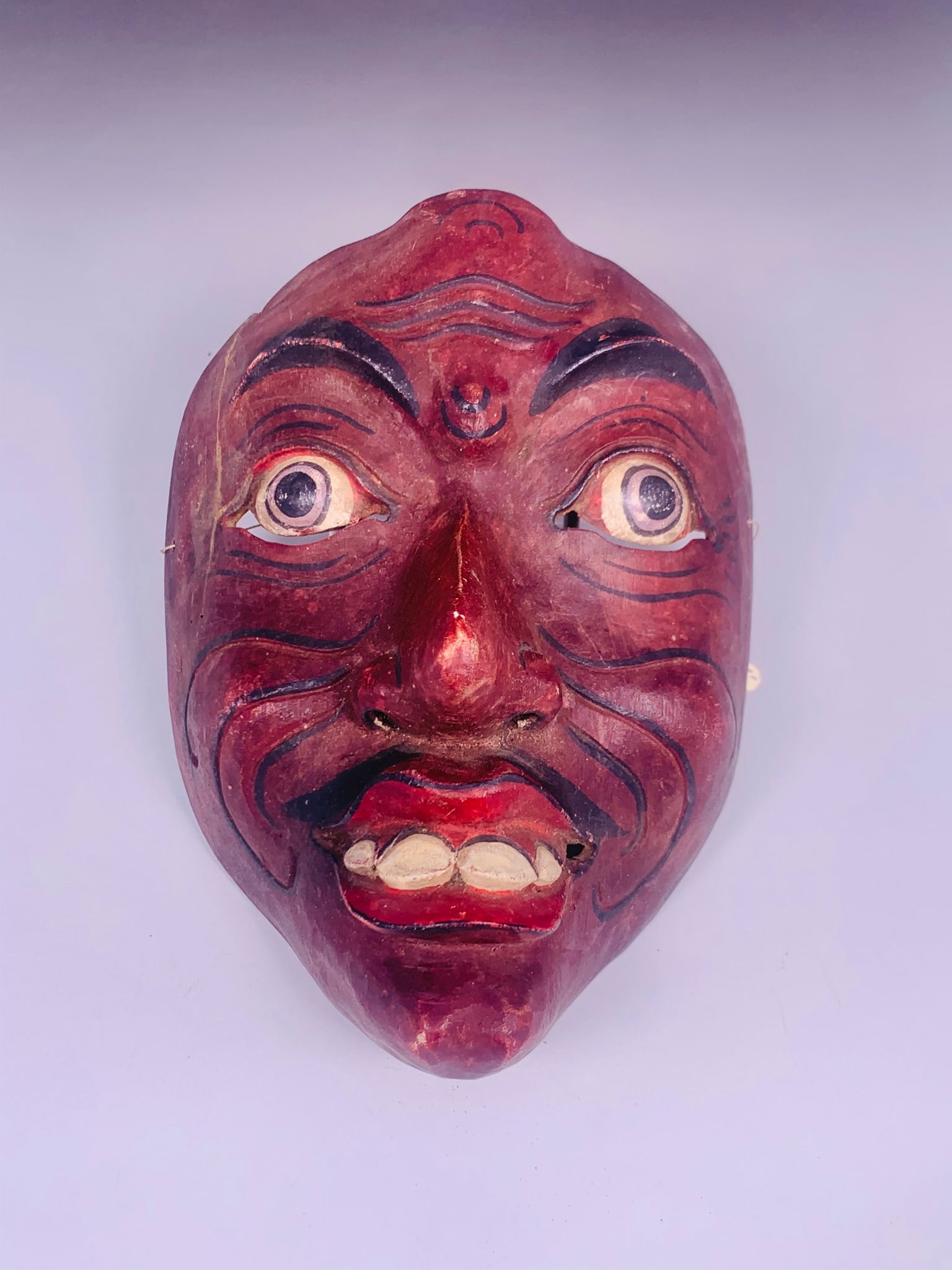 A Mask Bali: 7.1/4 in. long, 5.1/4 in. wide.