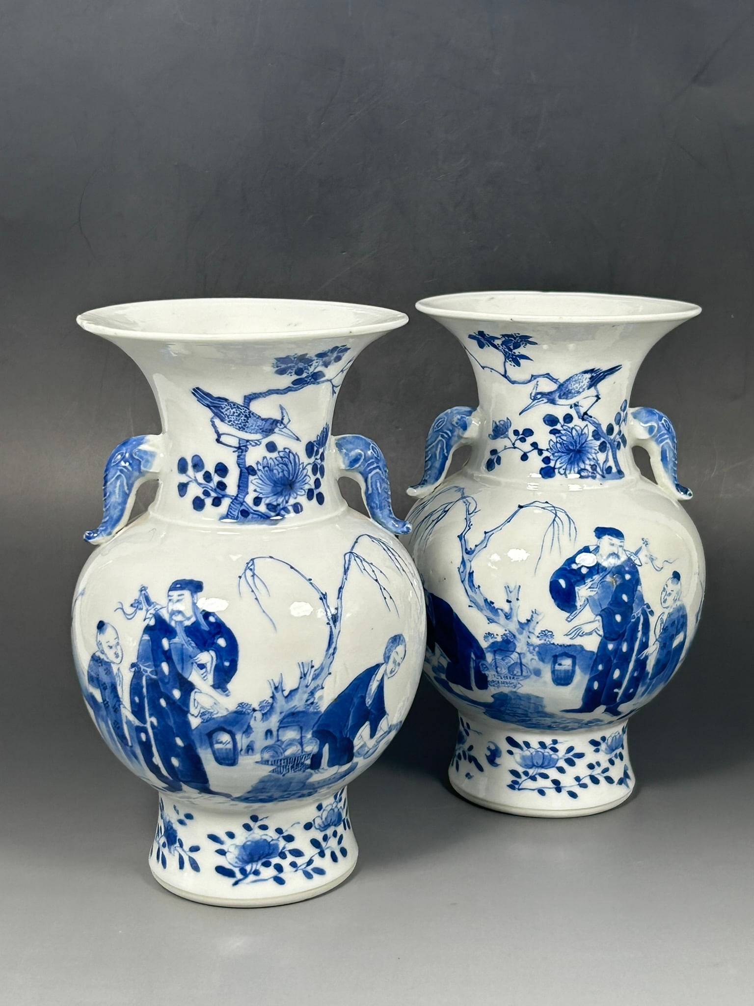 A Pair of Chinese Blue and White 'Figural' Vases, Zun, Guangxu Period, Qing Dynasty: Apocryphal Kangxi mark to the underside each. 8 in. high, 4.3/4 in. wide each.