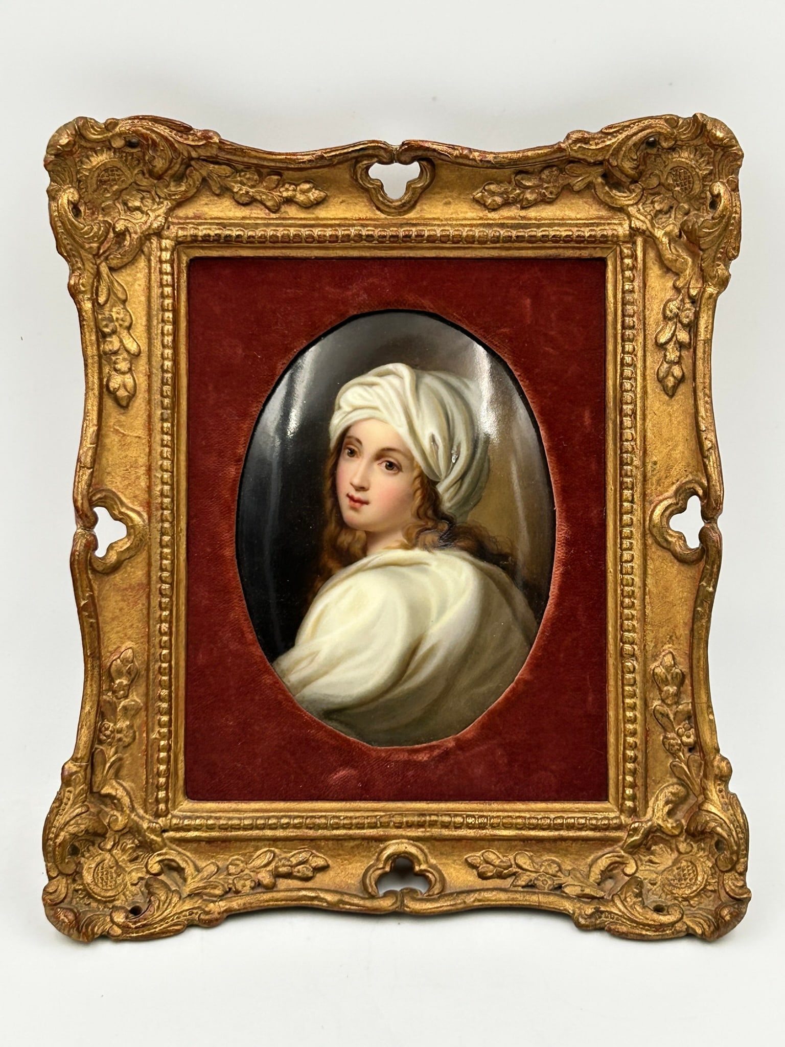 A Berlin KPM Porcelain Plaque of Beatrice Cenci: Based on the painting of Portrait of Beatrice Cenci by Guido Reni. 5.1/2 in. x 4.1/8 in. for the plaque, 9.1/2 in. x 8 in. for the frame.