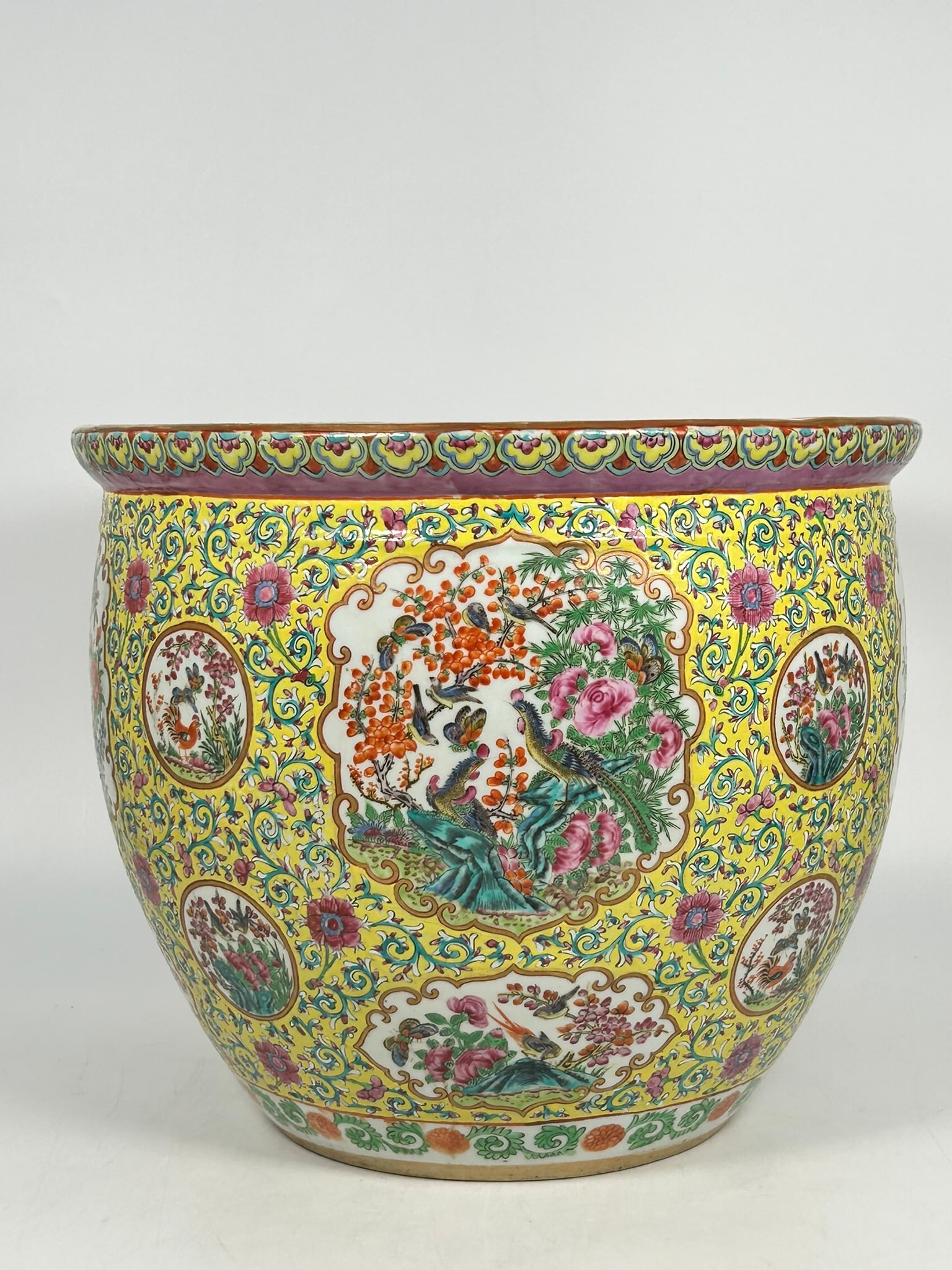 Christie's Tag: A Chinese Famille Rose Yellow Ground 'Medallion' Jardiniere, 19th Century: 12.1/4 in. high, 14.3/4 in. diam.