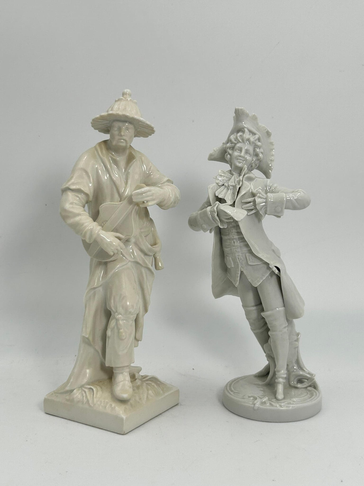 Two White-Glazed Berlin KPM Figures: Both with KPM marks to the undersides. 8.3/4 in. high, 3.1/4 in. wide for the taller one.