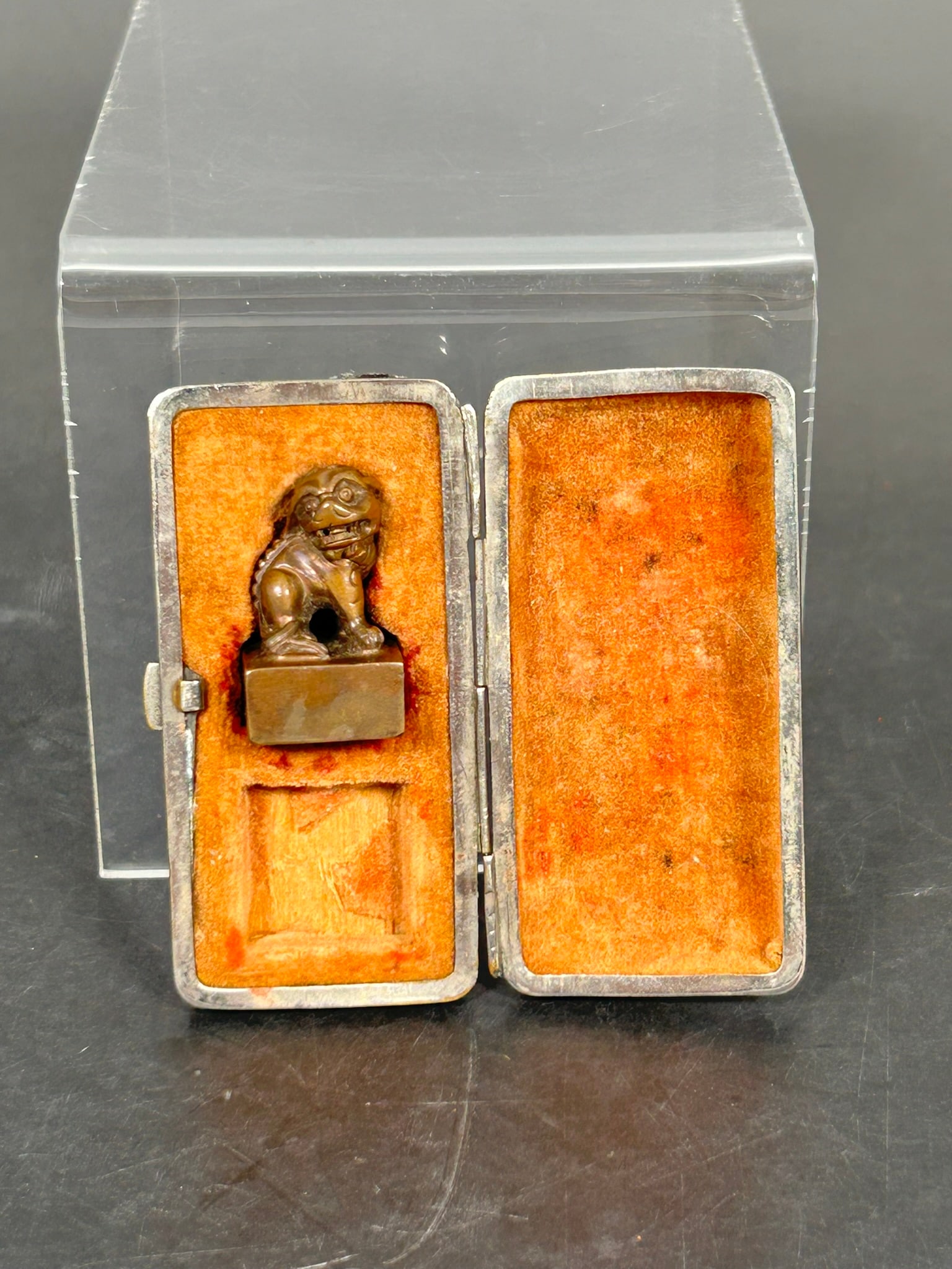 A Chinese Small Bronze Seal: 1 in. high, 5/8 in. wide. Cloth box.