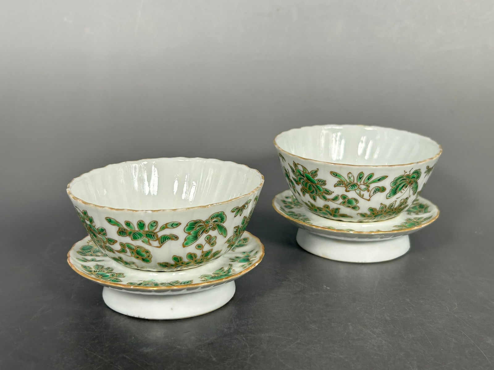 A Pair of Chinese Green and Gilt-Decorated Tea Cups and Stands, Qing Dynasty (1 of 9)