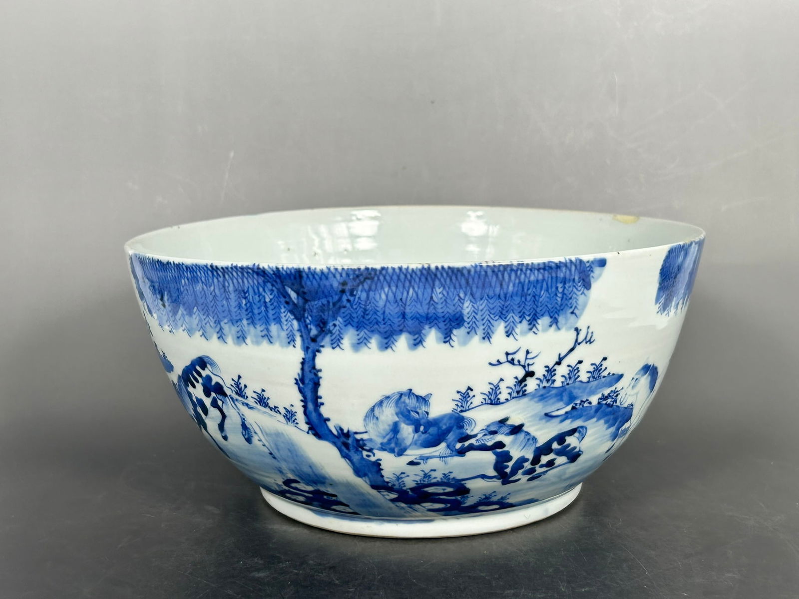 A Chinese Blue and White 'Eight Horses' Punch Bowl, Jin Tang Sheng Ji Mark: 5 in. high, 10.1/4 in. diam.