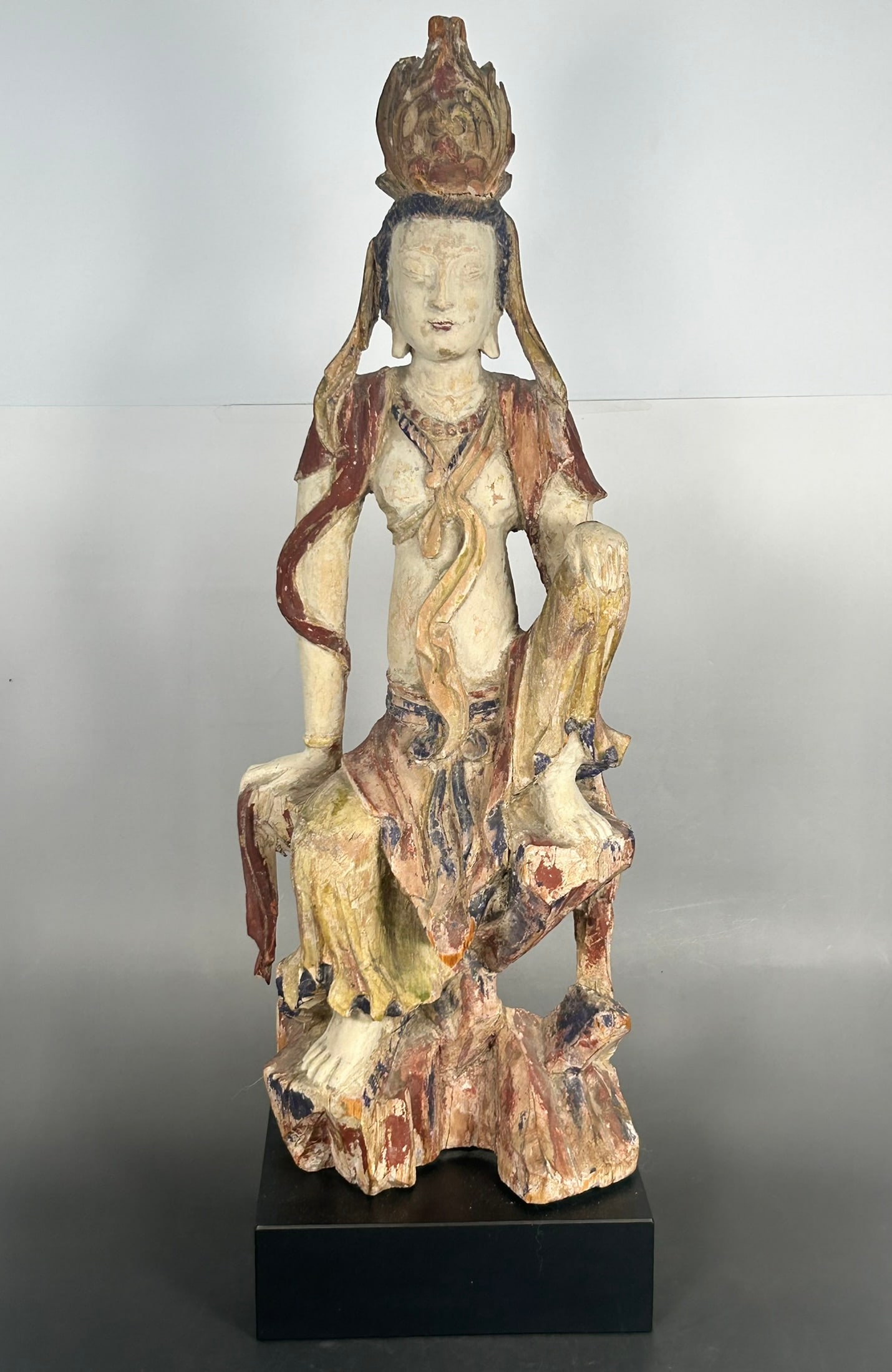 A Chinese Carved and Painted Wood Figure of Guanyin, Qing Dynasty: 24.1/2 in. high, 7.1/4 in. wide overall.