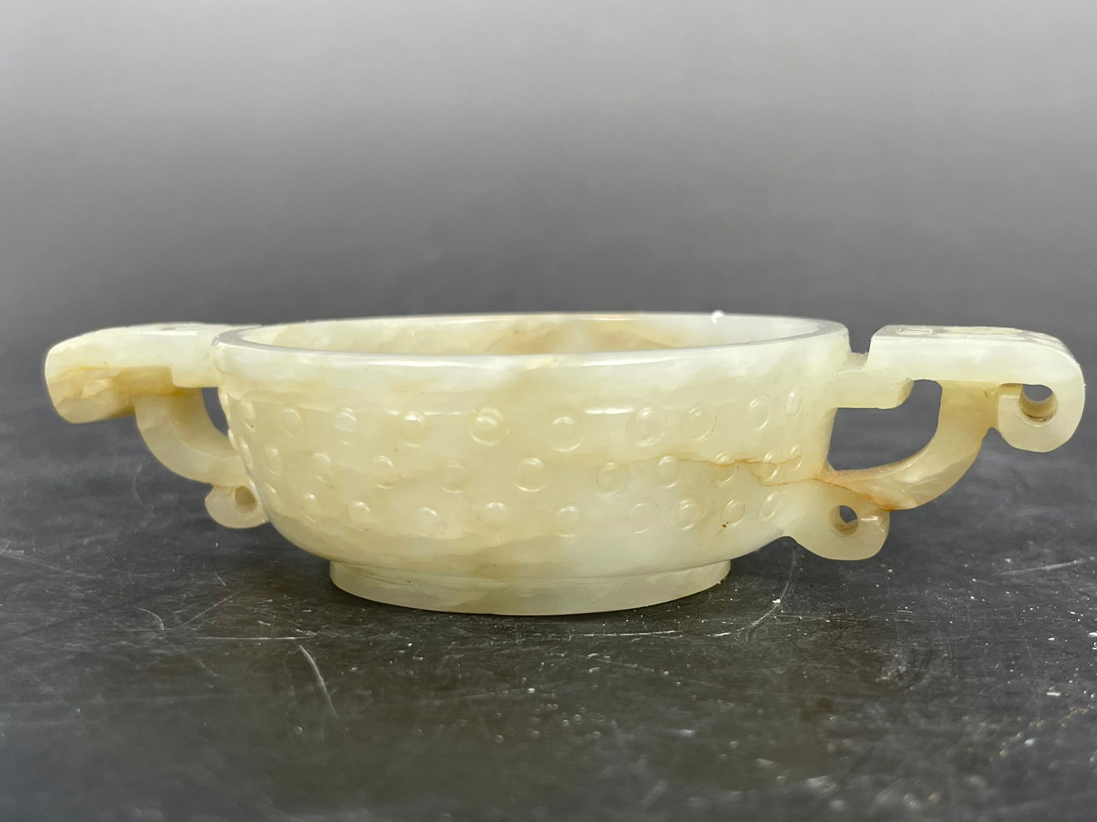 A Chinese White Mottled Jade Twin-Handled Cup, Ming Dynasty (1 of 7)
