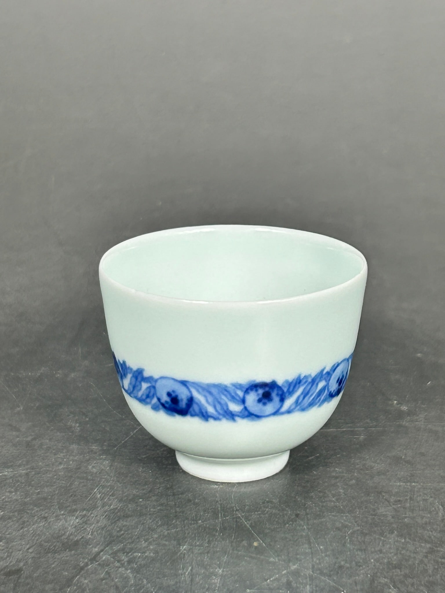 A Chinese Small Blue and White Cup, Kangxi Mark: 1.3/8 in. high, 1.3/4 in. wide.