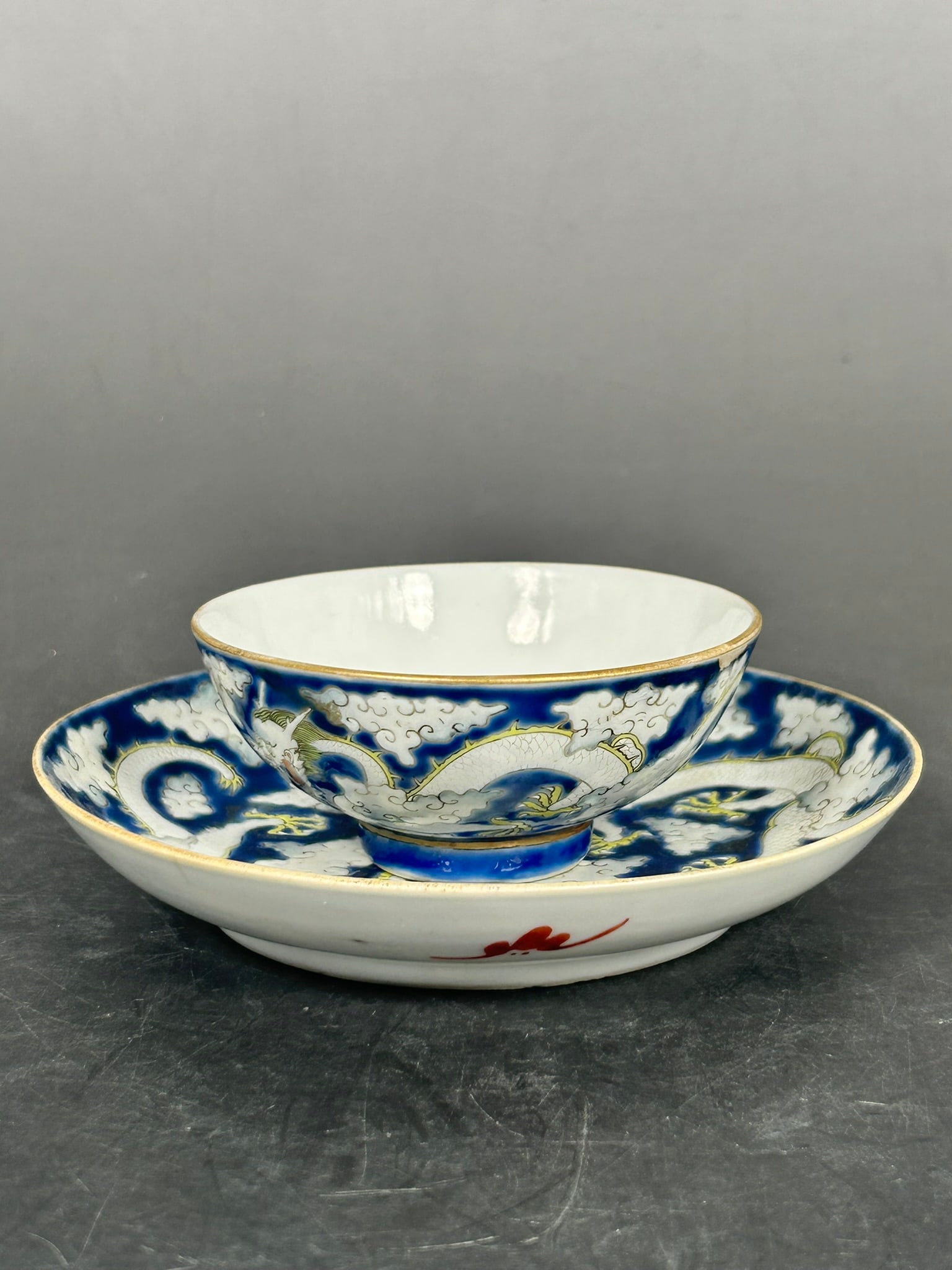 A Set of Chinese Famille Rose Blue-Ground 'Dragon' Tea Cup and Saucer, Daoguang Mark (1 of 14)