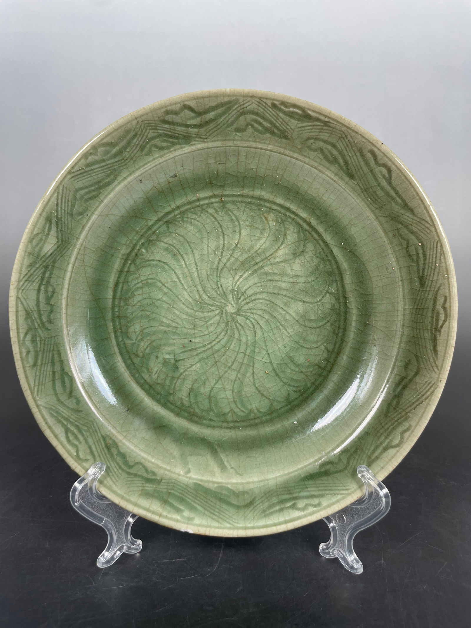 A Chinese Longquan Celadon Dish, Song Dynasty: 8.3/8 in. diam.