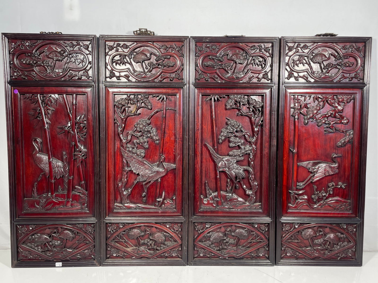 A Set of Four Chinese Rosewood Wall Panels: 42 in. x 16 in. for each panel.