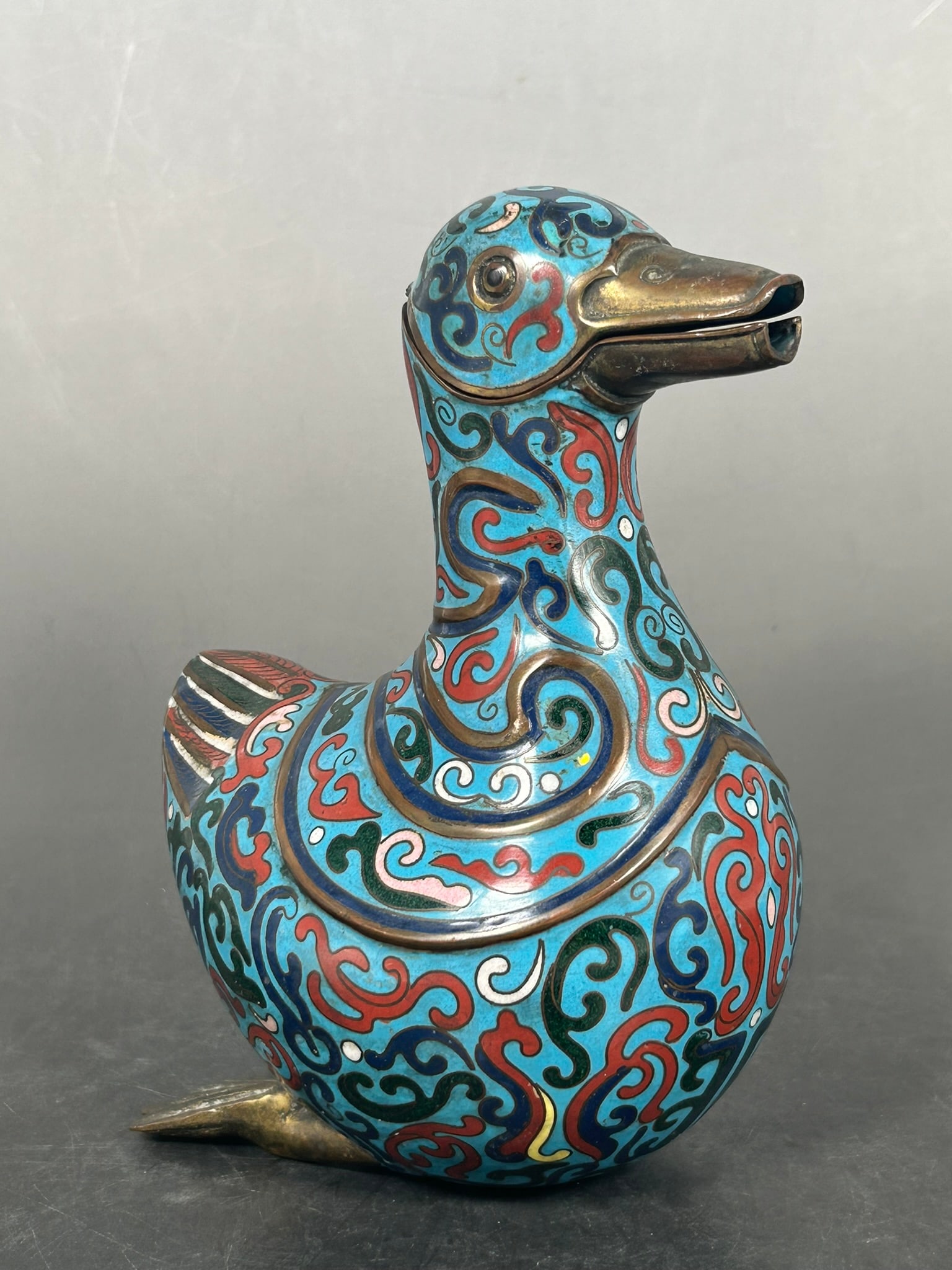 A Chinese Cloisonne Enamel Mandarin Duck-Form Ewer: 7.1/4 in. high, 5.1/2 in. wide.