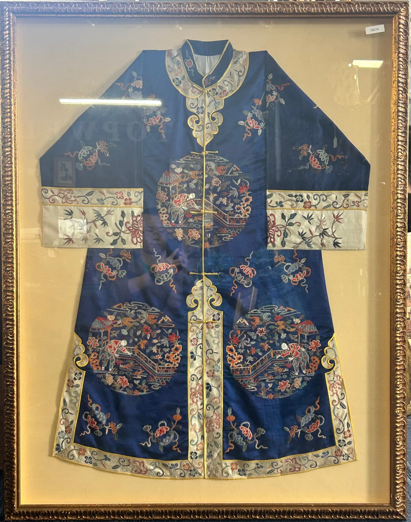 A Vintage Chinese Blue Embroidered Silk Informal Robe: Framed, 49 in. x 38.1/2 in. for the frame.