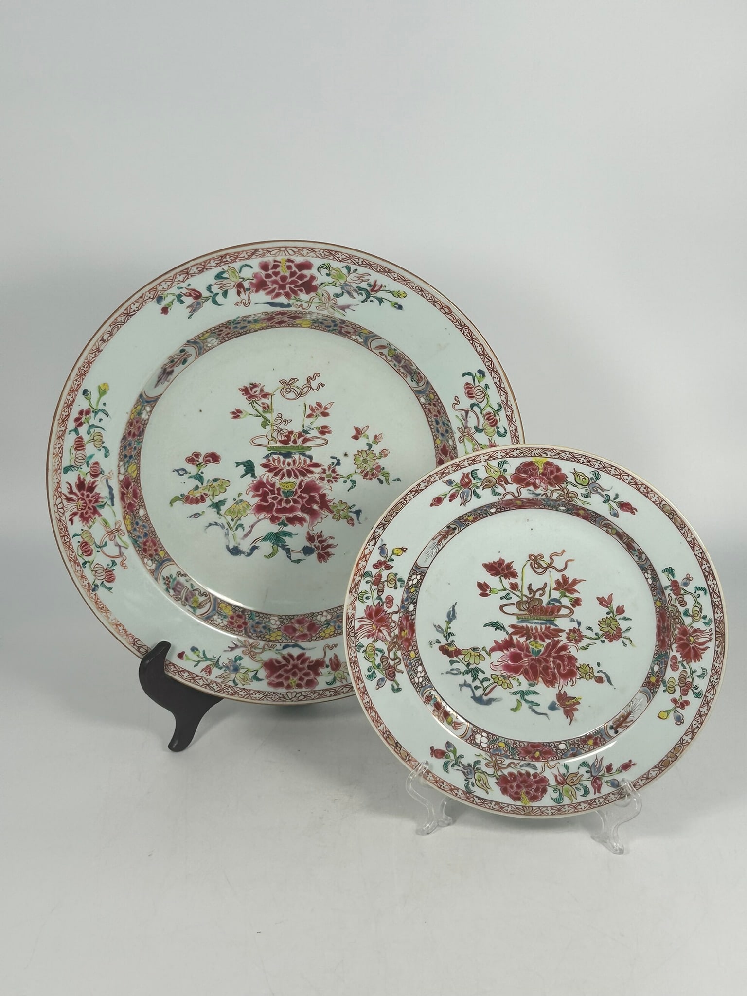 Two Chinese Famille Rose 'Flower Basket' Dishes, Qianlong Period: The larger one measures 12.1/2 in. diam.; the smaller one measures 9 in. diam.