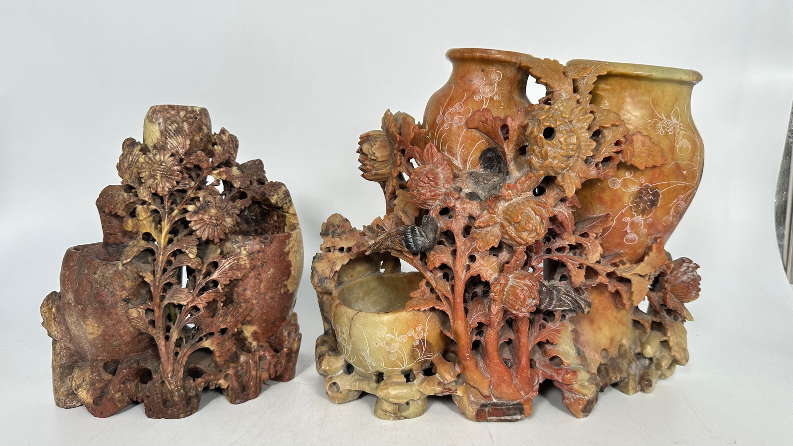 Two Chinese Carved Soapstone Vases: The larger one measures 9 in. high, 10.1/4 in. wide; the smaller one measures 7.5/8 in. high, 6.3/4 in. wide.