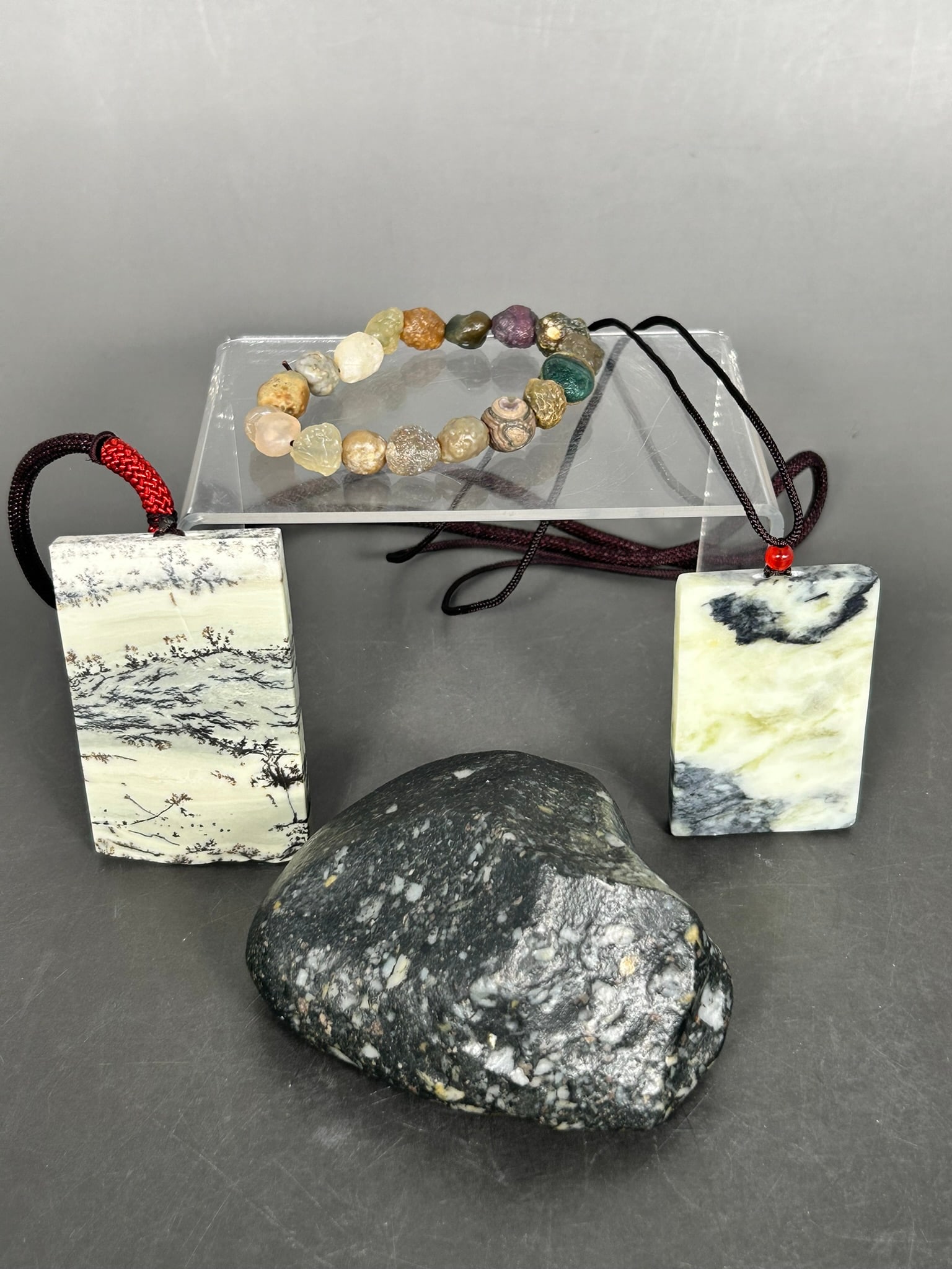 A Group of Four Stone Objects: The largest rock measures 2 in. high, 3.3/4 in. wide.