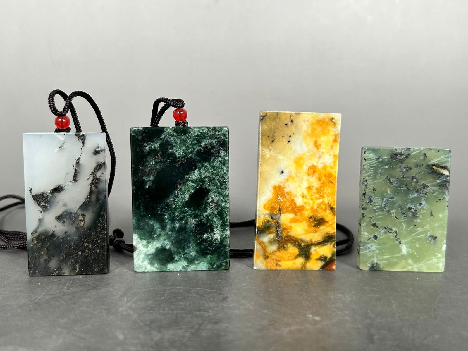 A Group of Four Rectangular Stone Plaques: The tallest measures 2.5/8 in. high, 1.3/8 in. wide.