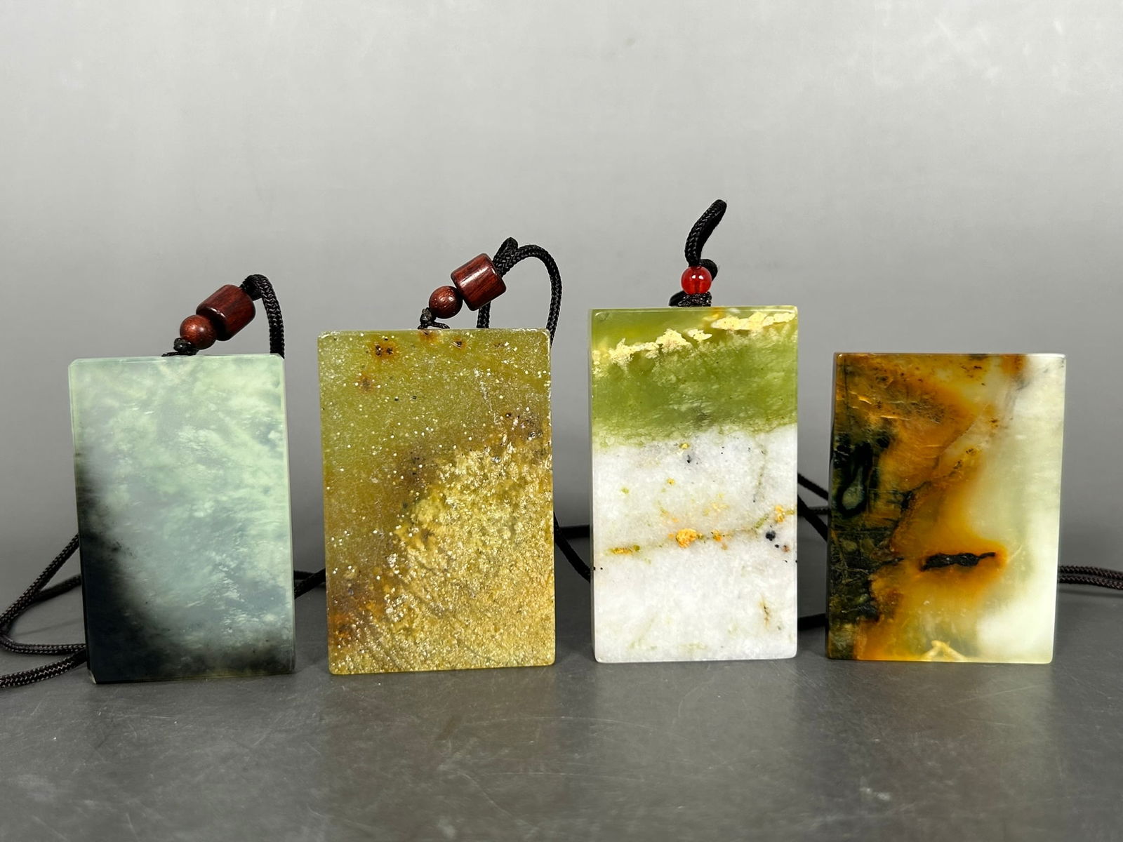 A Group of Four Rectangular Stone Plaques: The tallest measures 2.5/8 in. high, 1.1/2 in. wide.