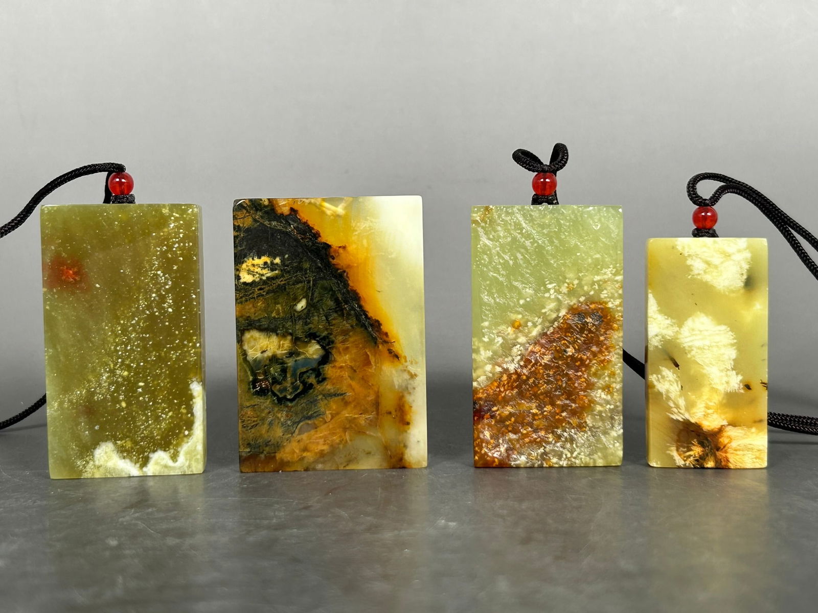 A Group of Four Rectangular Stone Plaques: The tallest measures 2.1/2 in.high, 1.3/4 in. wide.