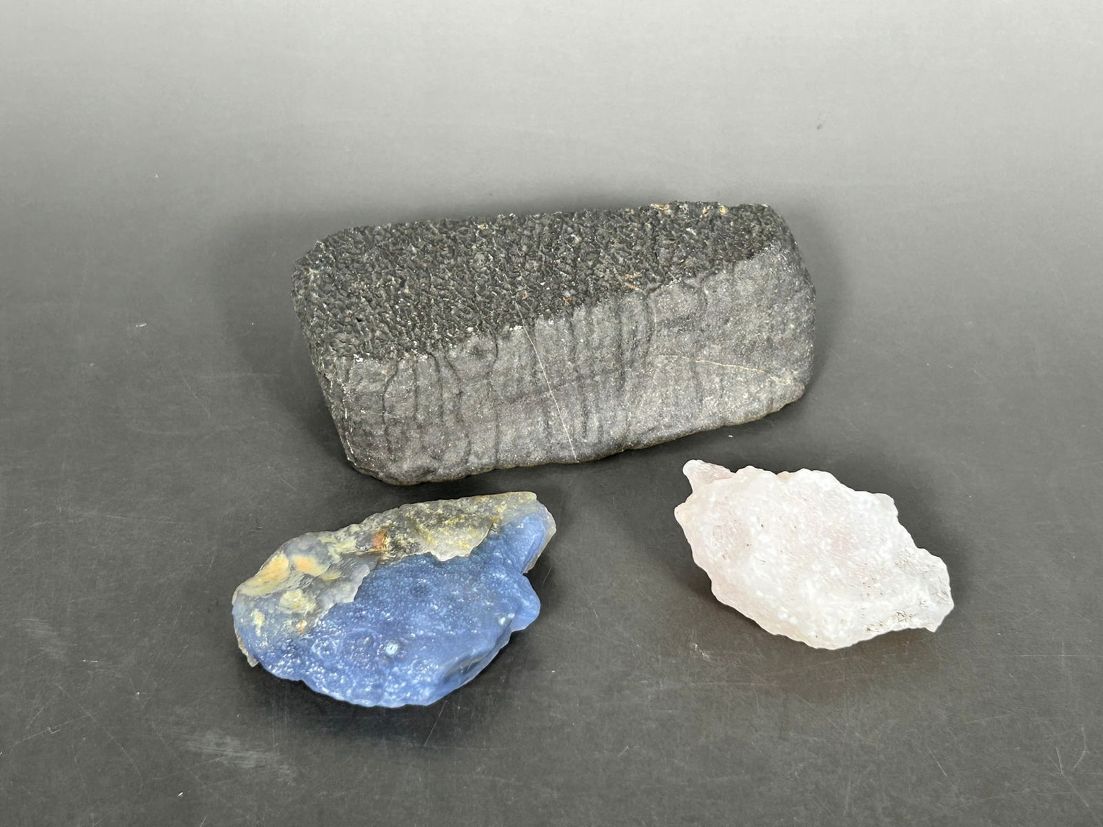 A Group of Three Stone Objects: The largest rock measures 1.1/4 in. high, 4.3/8 in. wide.